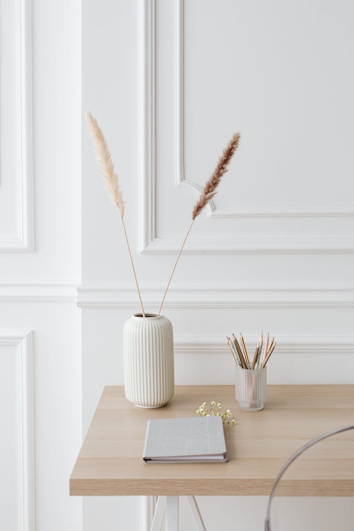 about-01 Minimalist desk setup with elegant decor and stationery for a clean and serene workspace.